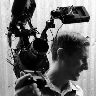 Olivier Bernier, a white man holding a film camera